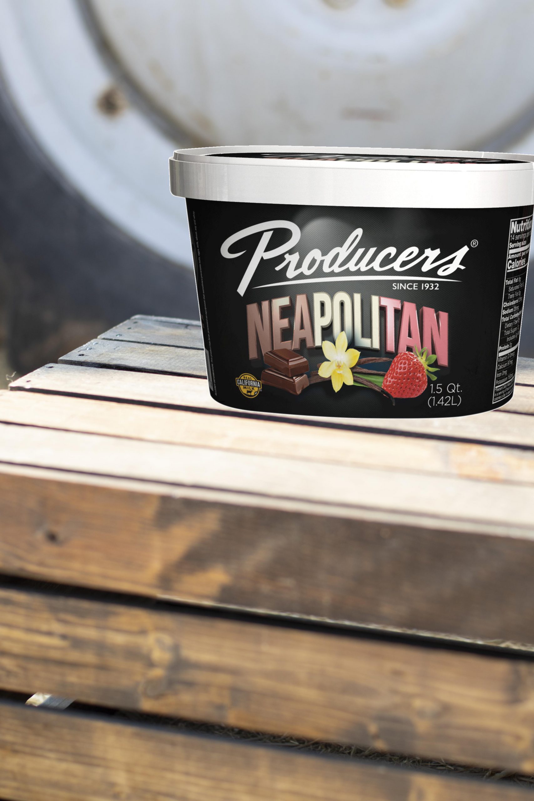 Neapolitan Producers Ice Cream sitting on wood in front of a tractor.