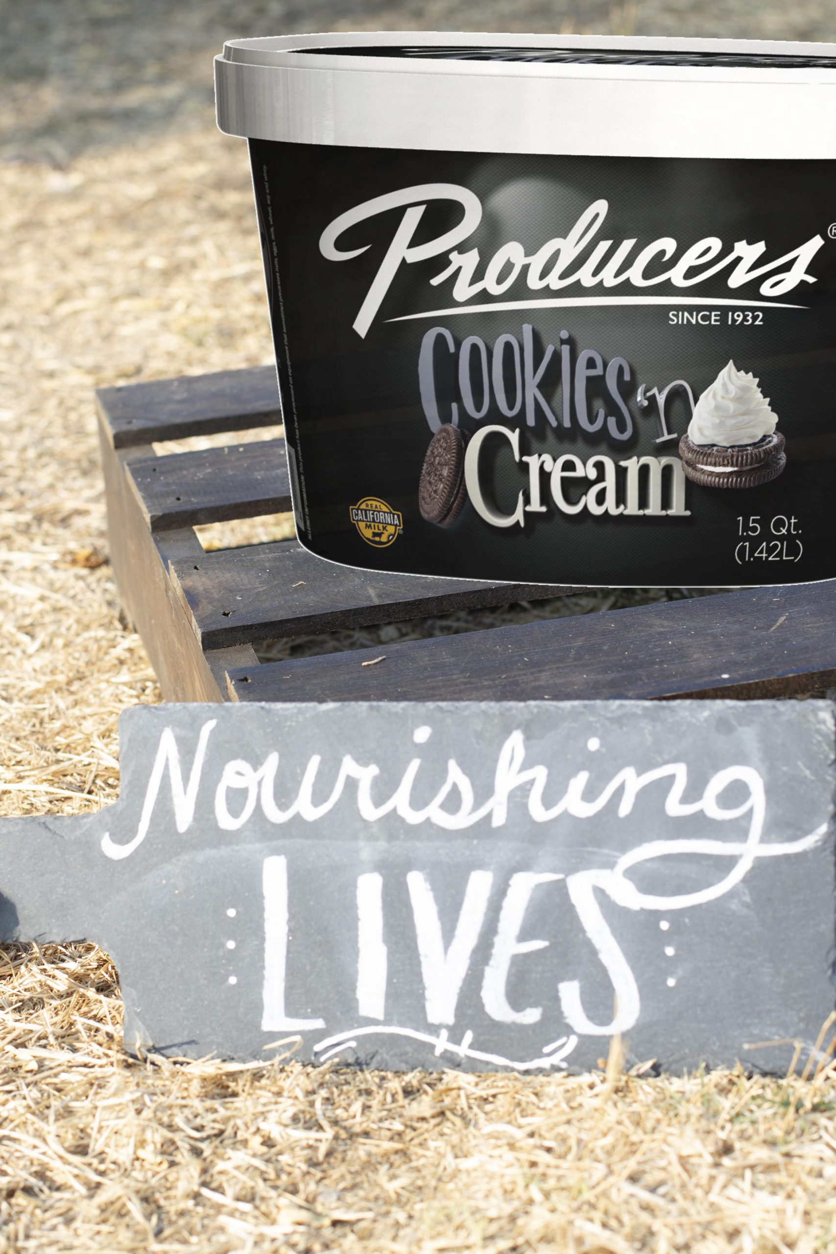 CookiesNCream_Farm Cookies N Cream Producers Ice Cream sitting on wood in the middle of a hay field.