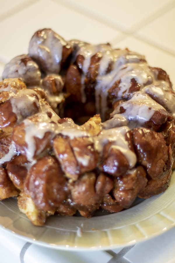 monkeybread5 Pumpkin Monkey Bread being frosted