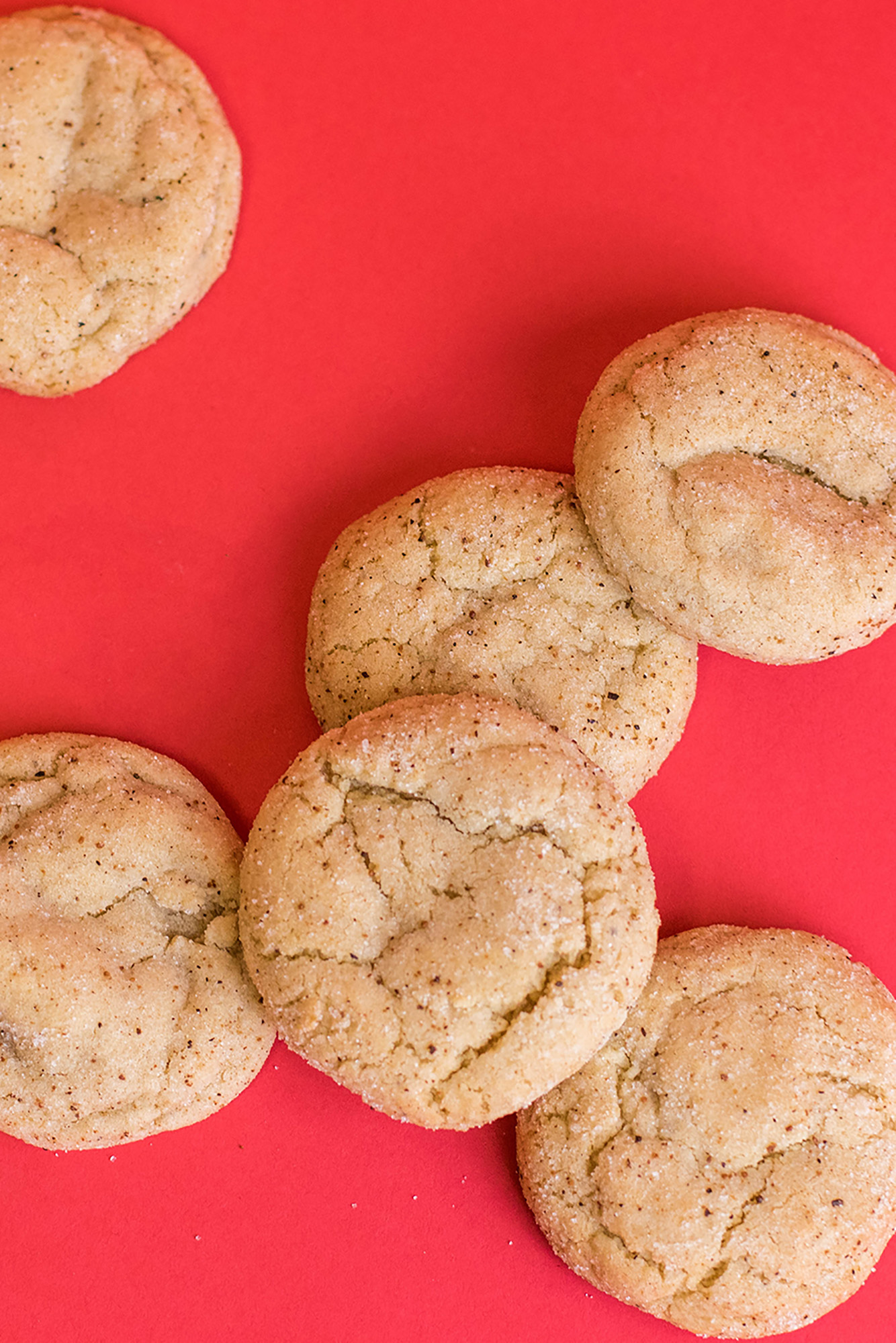 Website2 Egg Nog cookies spread out on a red background.